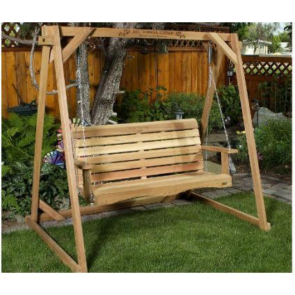 A-frame cedar porch swing stand set up outdoors as a freestanding alternative to ceiling-mounted hanging