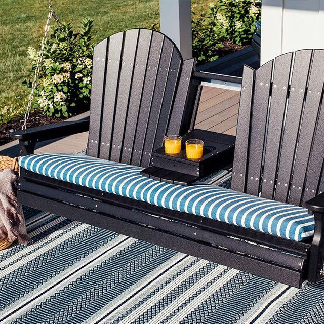 LuxCraft recycled plastic porch swing on a front porch in late fall