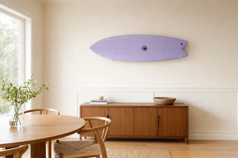Dining nook with a surfboard mounted on the wall (AI-generated visualization)